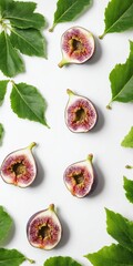 Canvas Print - Fresh figs with green leaves on white background. Top view flat lay