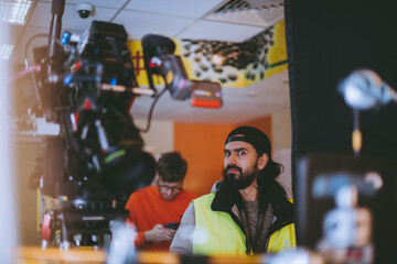 Canvas Print - Director of photography with a camera in his hands on the set.