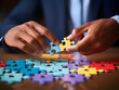 © Akilmazumder - Business puzzle, Colorful 3D Business Puzzle, Business people joining puzzle together, teamwork and unity in business concept