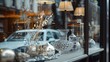 © Khalif - A closeup of the shop window showcasing various home decor items, including glassware and decorative accessories.
