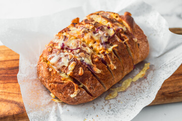 Wall Mural - homemade stuffed bread loaf with cheese and caramelised onion