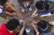 © Wavebreak Media - Diverse teenagers engage in a group activity at high school