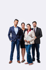 Indian asian young business professionals executive standing in group and looking at camera