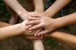 © Amni - A close-up of hands intertwined, representing support and connection