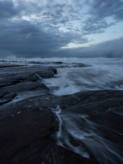 Wall Mural - Cloudy morning view on the rocky coastline.