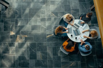 Poster - Overhead View of a collaborative business team meeting in a modern office with professionals. Diverse team using technology, laptops, documents, discussing, brainstorming, planning strategies