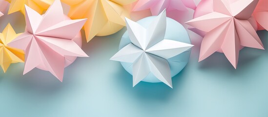Wall Mural - A collection of vibrant handmade origami balls, known as Kusudama, arranged against a blue backdrop. The image showcases the intricate art of paper folding with a close-up view and space for text