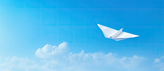 Wall Mural - Yellow handmade paper plane isolated on a white background with copy space image available for text integration.