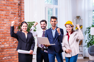 Wall Mural - Group photo of Indian asian construction company employees looking at camera