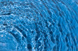© Maja  - Water with a shining rippled texture on a dark blue background. Abstract Water surface background idea. Abstract summer water background.