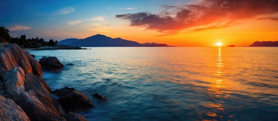 Aufkleber - Beautiful colorful sunset at the montains at the sea. Creative banner. Copyspace image