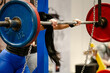 © Real Sports Photos - barbell for squat on monolith, woman athlete preparing to strength exercise