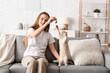 © Pixel-Shot - Young woman playing with cute kitten at home