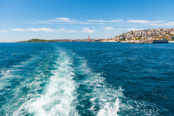 Wall Mural - Wave trail from speed travel boat on blue sea