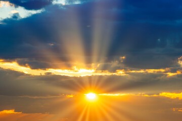 Wall Mural - sunset sky with sunset clouds, sun rays and dramatic sky