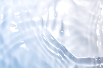 Wall Mural - the clear blue surface of the water gradients from light to dark.