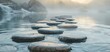 © N0X - Stepping stones in a tranquil stream with fog in the background.