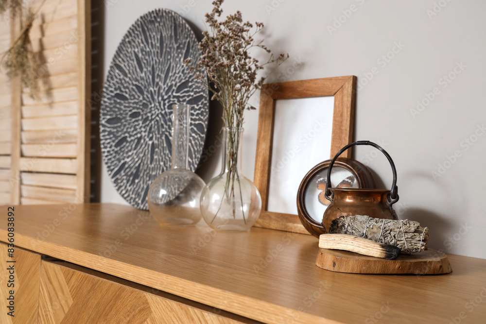 Palo Santo with cauldron on commode in witch's room, closeup