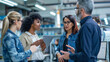 © Michael - Group Of Diverse Engineers Discussing A New Project With A Latin American Female Senior Engineer Offering Guidance, Highlighting Teamwork And Diversity In Technology For Potential Use In Corporate