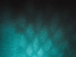 Wall Mural - light reflects blue shadows on a foam board in the dark for a minimalist abstract background.
