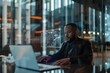 © LukaszDesign - Nighttime office phone call, futuristic black man with laptop hologram. Smartphone communication, futuristic mockup or man employee with computer for business, trading, or stock market