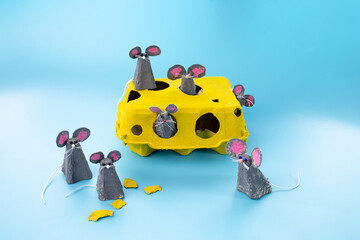 Wall Mural - Creative craft project made from yellow egg carton, transformed into six mice