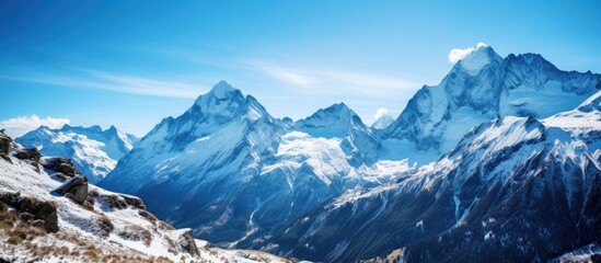 Wall Mural - Snow-capped mountain peak with copy space image.