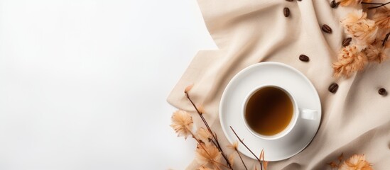 Wall Mural - fall-themed arrangement with beige reeds, a coffee cup on white backdrop, conveying autumn vibes wit