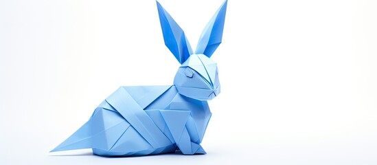 Wall Mural - blue rabbit origami on white backdrop with copy space image.