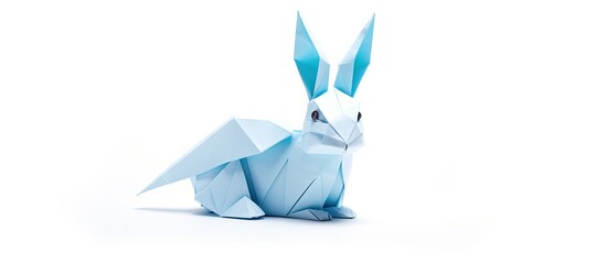 Wall Mural - blue rabbit origami on white backdrop with copy space image.