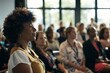 © Anastasia - Attentive woman with curly hair in yellow top listening at a conference
