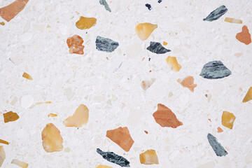 Leinwandbilder - A background with a lot of different colored rocks scattered all over it. The rocks are of various sizes and colors, creating a visually interesting and unique pattern