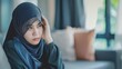 © A Denny Syahputra - Sad muslim hijab girl at home. Depression or anxiety concept