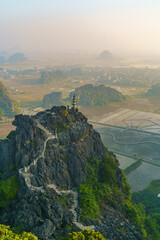 Canvas Print - Aerial view of a vast rocky cliff atop a hill