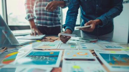 Close up ux developer and ui designer use augmented reality brainstorming about mobile app interface wireframe design on desk at modern office.Creative digital development agency 