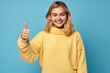 © luismolinero - Young pretty blonde girl over isolated colorful background with thumb up