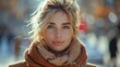 © Maxim Borbut - Pretty blonde woman at street level wearing winter coat and scarf. Beautiful female with straight hairstyle standing in the street with the sun behind her.