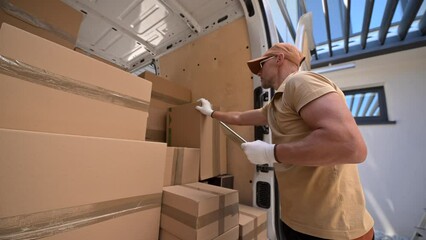 Wall Mural - Courier Loading Boxes Into Delivery Truck