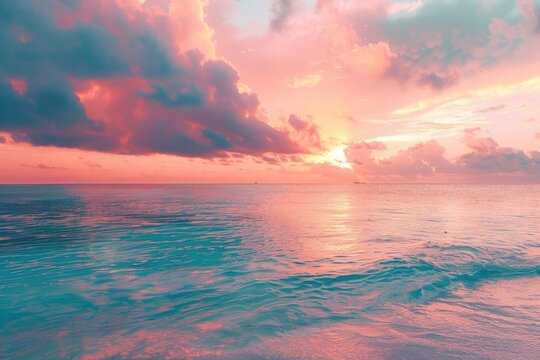 Beautiful sunset on the Maldives beach with turquoise water and soft clouds. Landscape of an idyllic tropical island background