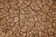 © Austockphoto - Dry brown cracked soil texture from above