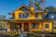 © Hasnain Arts - Contemporary Craftsman Style New Construction Sunflower Yellow House Highlighting Minimalist Design and Eco-Friendly Materials