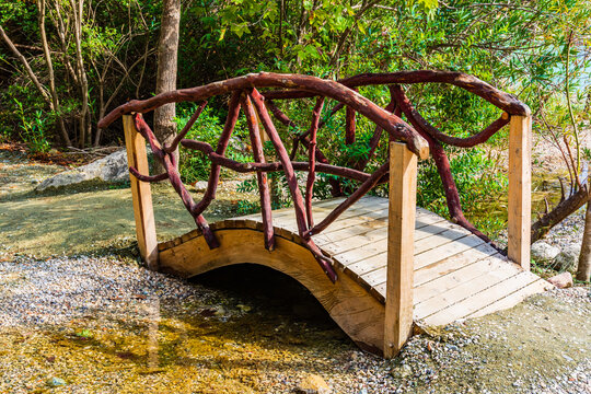 Small arched wooden bridge across the stream in a Goynuk canyon. Antalya province, Turkey