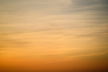 Wall Mural - The sky at dusk was painted with a gradient of orange clouds.
