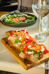 Wall Mural - Bruschetta on pieces of baguette with cheese