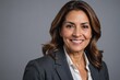 © ThomasLENNE - portrait of Latin Hispanic mature adult professional business woman looking at camera and smiling.