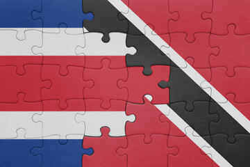 Wall Mural - puzzle with the colourful national flag of trinidad and tobago and flag of costa rica .