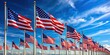 © wasan - American flags lining up against a vibrant blue sky as a symbol of national pride