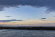 © Caseyjadew - People walking along breakwall, late afternoon at Brunswick Heads