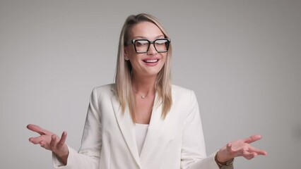 Wall Mural - close up of businesswoman making open hand gesture and clapping her hands while making ok sign