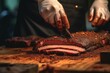 © alisaaa - bbq chef cuts deliciously tender smoked brisket slices